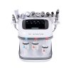 Air Essence™ Small Bubble Machine urządzenie do hydradermabrazji to białe urządzenie do twarzy z ekranem dotykowym, trzema przezroczystymi butelkami z roztworem oznaczonymi S1, S2, S3 oraz 11 odłączanymi końcówkami zabiegowymi na górze i po bokach.